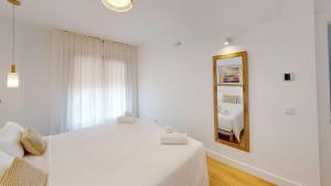 Кровать или кровати в номере Apartamentos La Casa El Palo
