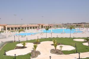 a view of a pool with people swimming in it at Tolip El Fairouz Hotel in Ismailia