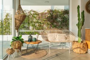 a living room with two chairs and a table at Blue Harbour Boutique in Ayia Napa