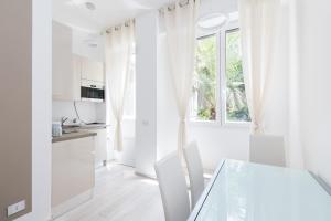 A television and/or entertainment centre at MagnoliaApartments - 18A Visconti Duomo