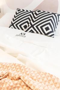A bed or beds in a room at Apartamentos Martalia Nerja