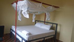 Ένα ή περισσότερα κρεβάτια σε δωμάτιο στο Farmhouse Lodge