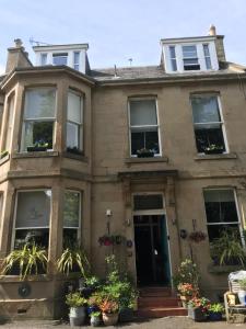 a large building with a large window on the side of it at Albyn Townhouse in Edinburgh