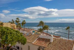 a view of the ocean from a building at Macdonald Doña Lola Resort in La Cala de Mijas