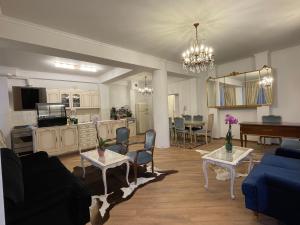 a living room with a couch and a table at Villa al Tempio in Pazardzhik