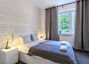 Postel nebo postele na pokoji v ubytování Mieszkanie MoLove - NoclegiSopot