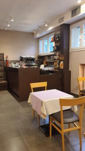 a kitchen with a table and chairs and a counter at Hotel Laguna Residence in Marghera