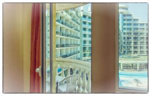 a view of a balcony from a hotel room window at Apartments in Victoria Residence in Sunny Beach