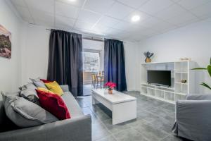 Televízia a/alebo spoločenská miestnosť v ubytovaní Loft Life 1