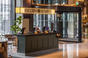 a sign for a service station in a building at Comfort Hotel Copenhagen Airport in Copenhagen