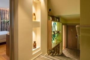 a corridor of a hotel room with a bedroom at ibis Styles Beaulieu sur Mer in Beaulieu-sur-Mer