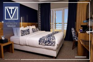 מיטה או מיטות בחדר ב-Hotel Vitality Terminus