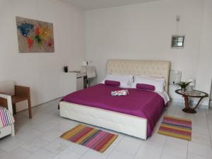 A bed or beds in a room at Bnbook Villa Biancospino