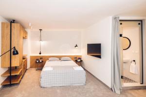 A bed or beds in a room at Antares City Sozopol