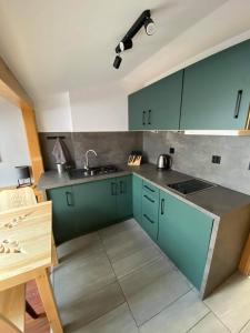 Kuchyňa alebo kuchynka v ubytovaní Apartamenty pod Skosami