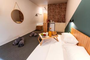 Posteľ alebo postele v izbe v ubytovaní Unique Experience Apartment’s