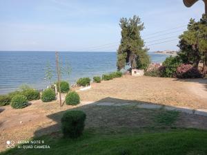 a view of the ocean from a house at Sunset Apartment in Epanomi