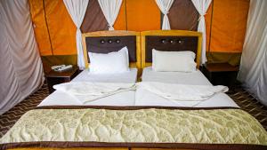 Postel nebo postele na pokoji v ubytování Cozy Ethnic Camp