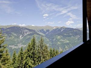 a view of a mountain range from a house at Appartement Courchevel 1550, 3 pièces, 6 personnes - FR-1-514-23 in Courchevel
