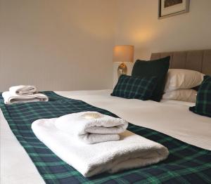 A bed or beds in a room at Iona