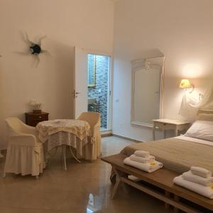 Posteľ alebo postele v izbe v ubytovaní Bianca Suite Polignano