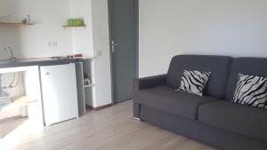 a living room with a couch and a table at Bungalows Filippi in Porto-Vecchio +85 photos