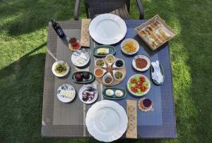 an overhead view of a picnic table with plates of food at Sahil Butik Otel in Cesme