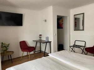 Postel nebo postele na pokoji v ubytování Hotel am Hafen
