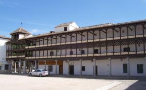 a building with a car parked in front of it at Castillo de Orgaz gratis la entrada y cerca del Puy du Fou hoy! in Manzaneque