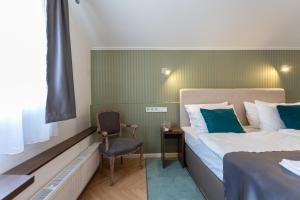 Postel nebo postele na pokoji v ubytování Heritage Hotel Petrakija