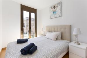 Postelja oz. postelje v sobi nastanitve Stay U-nique Apartments Urgell