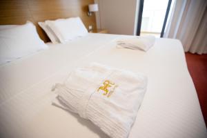 Postel nebo postele na pokoji v ubytování Hotel Jaroal