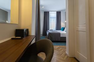 Postel nebo postele na pokoji v ubytování Heritage Hotel Petrakija