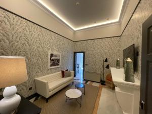 a living room with a couch and a table at Soho Boutique Castillo de Santa Catalina - Adults Recommended in Málaga