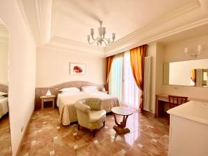 Postel nebo postele na pokoji v ubytování Hotel Aurelia