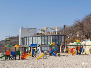 a playground in front of a building at Апартаменты у моря Magnit первая линия in Odesa