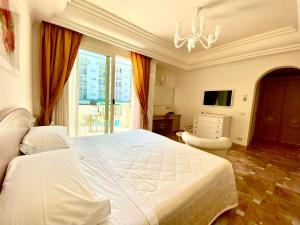 Postel nebo postele na pokoji v ubytování Hotel Aurelia