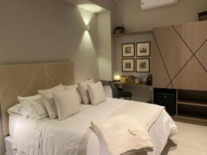 Postel nebo postele na pokoji v ubytování Lunalá Hotel Boutique