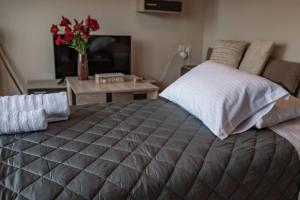 Posteľ alebo postele v izbe v ubytovaní El sueño de Zante City Center Apartments