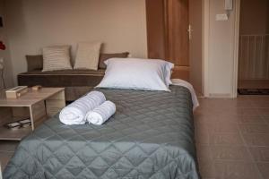 Posteľ alebo postele v izbe v ubytovaní El sueño de Zante City Center Apartments