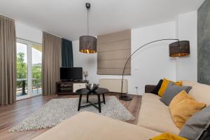 a living room with a couch and a table at Villa Vires in Labin