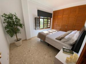 A bed or beds in a room at Villa Carolina with private pool
