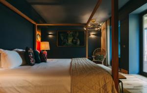 a bedroom with a bed and a night stand at Torel Avantgarde in Porto
