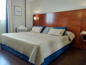Postel nebo postele na pokoji v ubytování Hotel Hidalgo