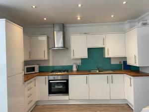 A kitchen or kitchenette at Bow Serviced Apartments
