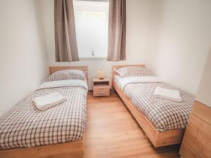 Säng eller sängar i ett rum på Alpenglueck Tauplitz