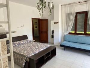 Кровать или кровати в номере B&B Tra Mare e Marmo