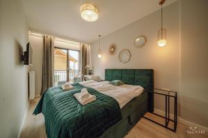 Posteľ alebo postele v izbe v ubytovaní Apartament Silence Karpatia Resort Nefryt