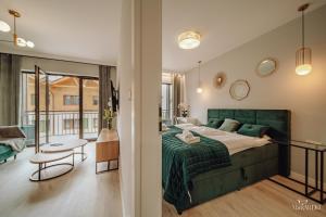 Posteľ alebo postele v izbe v ubytovaní Apartament Silence Karpatia Resort Nefryt