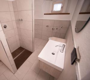 a white bathroom with a sink and a shower at Bhotanica - ospitalità e natura in Aosta +84 photos
